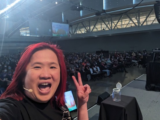 Mariatta selfie on PyCon US 2024 stage with the 2000 audience behind her