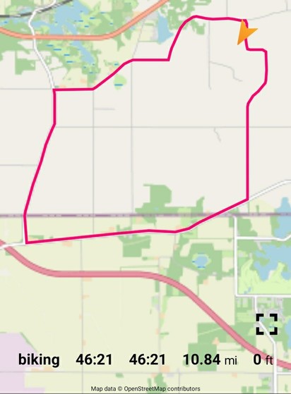 A map of a bicycle ride. A pink line traced a 10.8 mile loop.