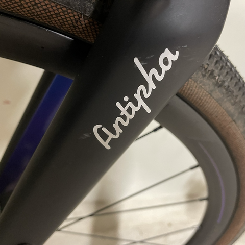 Detail of a bike fork with a sticker « antipha »