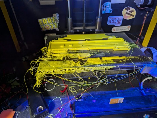 bright yellow spaghetti mess on 3d printer bed