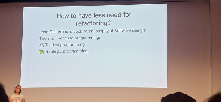 Mäelle in front of a screen about how to avoid needing refactoring showing two