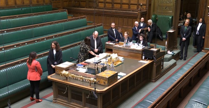 A picture of the centre table and the speakers seat, with officials around