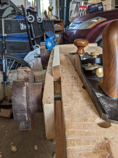The board held in a Moxon vise with a lovely bevel planed down the first edge.
