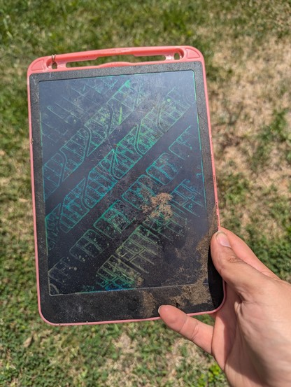 electronic etch a sketch with a tire track across the screen