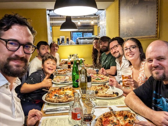 Italian Pythonistas eating a pizza