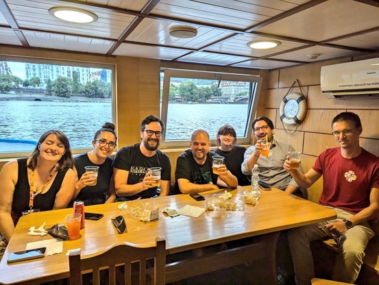 People toasting in a boat 
