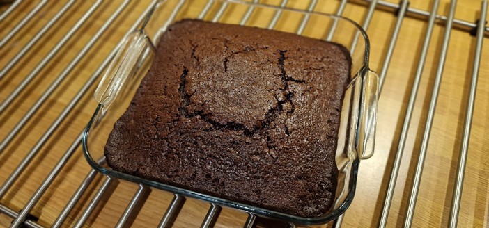 Photo of a chocolate cake fresh from the oven. Recipe in the alt of the above post.
