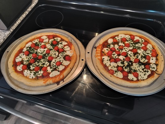 Two homemade margherita pizzas