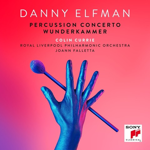 Cover of Danny Elfman’s Sony Classical album “Percussion Concerto - Wunderkammer”, featuring a graphic of a blue hand holding a percussion mallet on a red background.