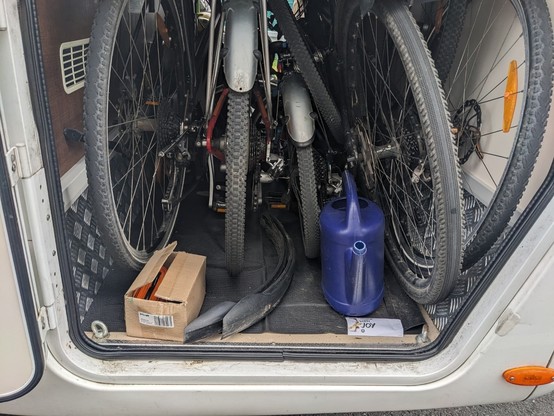 look into the trunk of an RV with 4 bikes stores into it