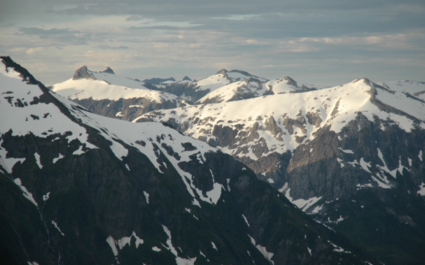 snow-covered mountain ridges in late evening light