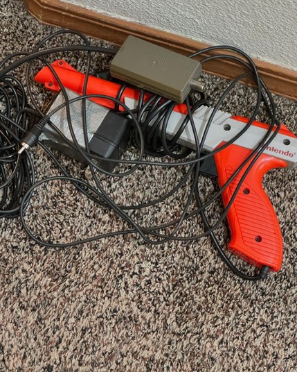 Original NES Zapper along with a duct-taped 9V power supply.