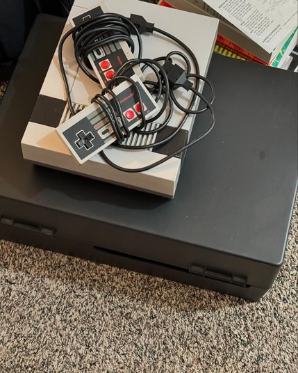 Original NES console with two controllers.