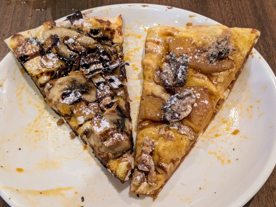 Two slices of pizza. Left is chocolate and banana; right is apple cinnamon.