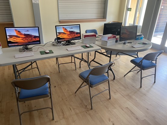 Raspberry Pi computers set up in a village hall, with no people