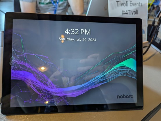 the login lock screen on a fresh Nobara install on a Surface Pro of unknown year