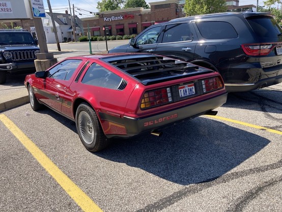 Left rear view of a DeLorean in a parking lot.  Ohio license plate is visible.