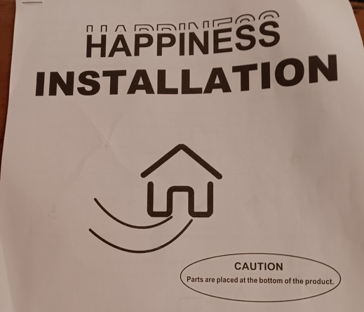 Pic of instructions to assemble furniture, in big letters the cover says Happiness Installation