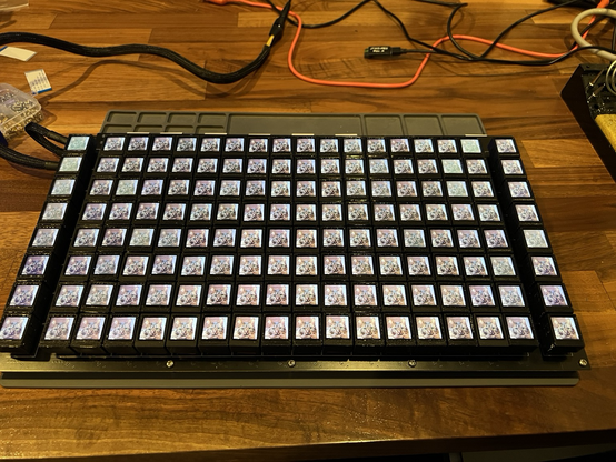 18x8 grid of 128x128 pixel LCDs mounted on 3D printed key caps on mechanical key switches