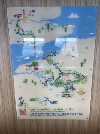 Poster displaying a cartoonish map of the cycle route from London to Paris