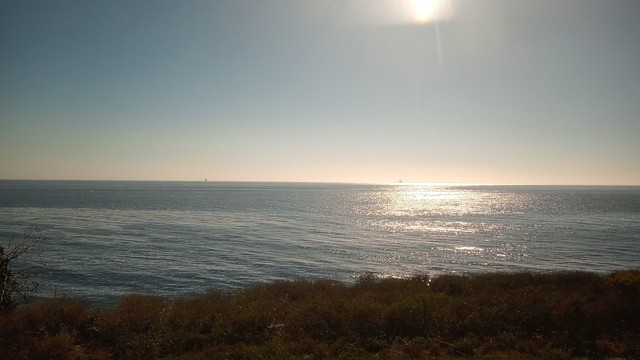 A view of the Pacific Ocean from a train.
