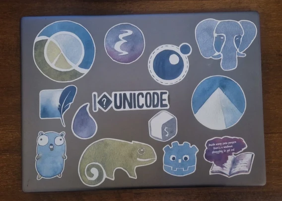 Notebook full with watercolor drawn stickers of Coding Stuff.