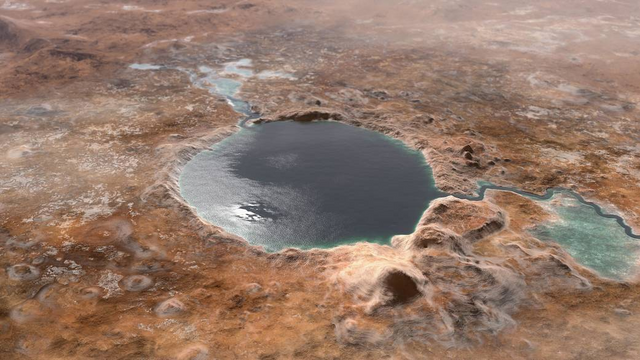 Illustration of Jezero Crater on Mars as it may have looked billions of years ago, when it was a lake. An inlet and outlet are also visible on either side of the lake.