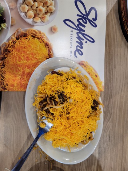 A full plate of Skyline chili, 5 way. 