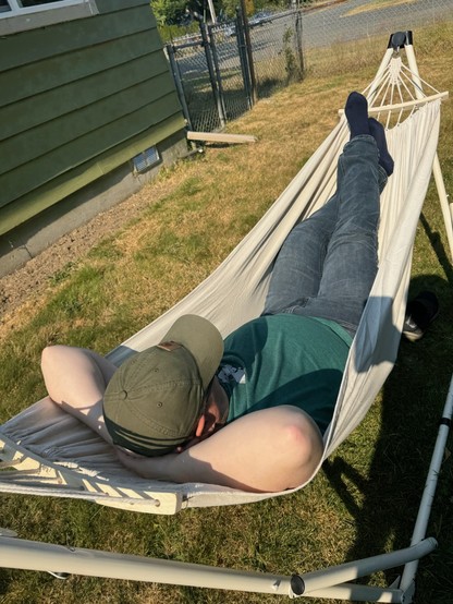 Me resting in a hammock in the backyard.