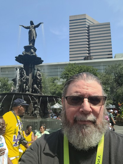 An old nerd in front of The Genius of Water statue in Cincinnati Ohio. 