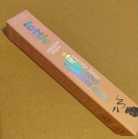packaging for eyeliner pen with a winged stamp and fine tip