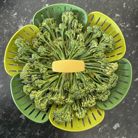 Tenderstem broccoli arranged radially in a Joseph Joseph steamer basket