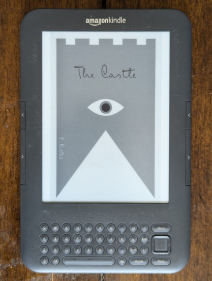 The front side of an ostensibly normal Kindle 3 (the one with the keyboard), showing the cover of Kafka's 