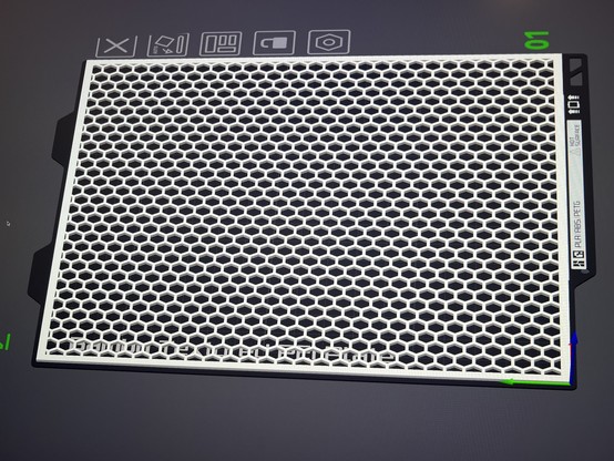 A hexagonal mesh grid displayed on a 3D printer bed preview with design tool interface elements visible at the top.