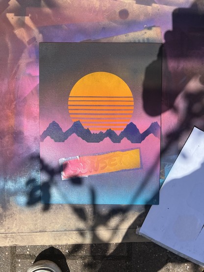 Spray-painted artwork featuring a yellow-orange sun setting behind purple mountains, with the word 