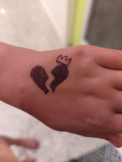 A broken heart In ink on my daughter's hand.