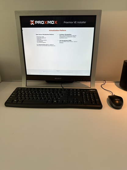 Monitor and keyboard, monitor is displaying the Proxmox graphical installer