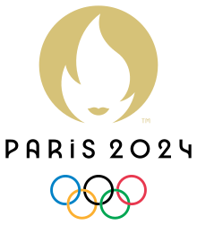 The Paris 2024 Olympics logo. A golden circle with a white torch flame in the center. The words Paris 2024 underneath. The Olympics rings under those words: five interlocking rings; blue, black, red, yellow and green.
