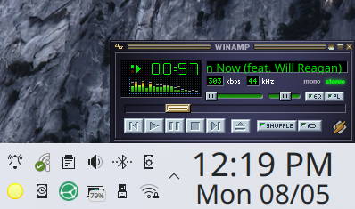The QMMP music player with a classic #WinAmp skin in the KDE Plasma desktop with a couple plasmoids visible on the panel: the system tray (eat rocks, Gnomies XD) with a bunch of icons, and a clock/calendar.

Desktop background is just visible. Taken from Mac OS X El Capitan or High Sierra default wallpaper.