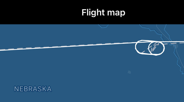 A flight path running west to east over Nebraska.  The line is punctuated by loops resembling a paperclip.