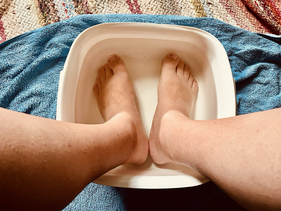 Hot feet soaking in ice cold water on a hot day. 