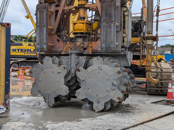 The business end of a digging machine, showing two sets of meta disks, each one with six cutting heads.