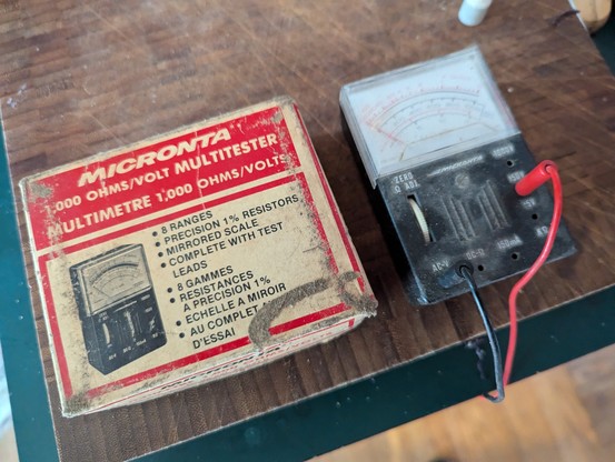 A cardboard case labelled Micronta Multitester is shown next to the tester itself. The box appears to be the original one from the 70s.