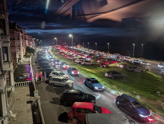 Long lines of traffic at night - lots of red and white car lights.