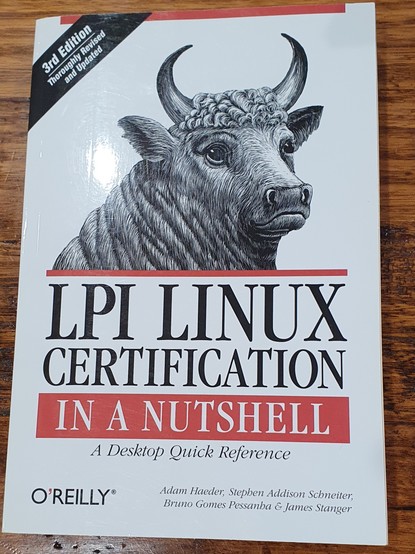 cover of OReilly LPI linux Certification book with vintage illustration of a wistful steer.