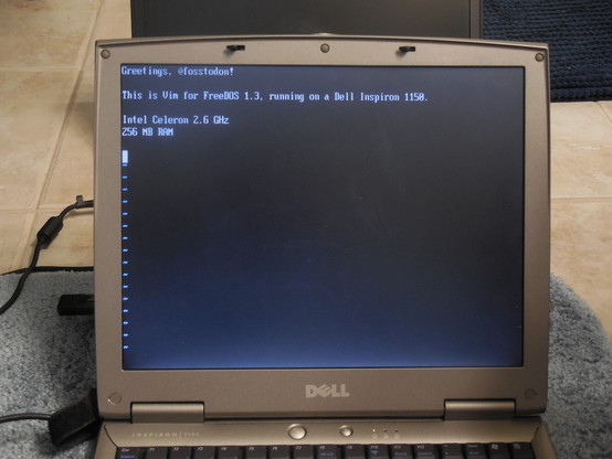 Photo of a laptop sitting on the floor. Onscreen, in the Vim text editor, it reads:

Greetings, @fosstodon!

This is Vim for FreeDOS 1.3, running on a Dell Inspiron 1150.

Intel Celeron 2.6 GHz
256 MB RAM