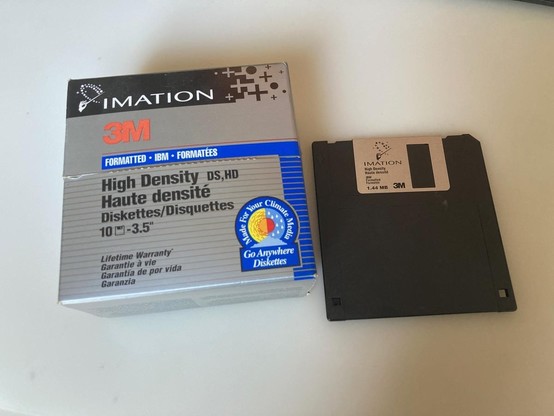 A picture of a floppy and a floppy box.