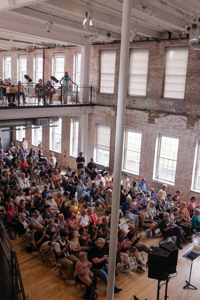 Photo of audience applauding after performance.