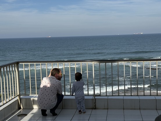 Myself and my son on our deck with a view of the Indian Ocean.