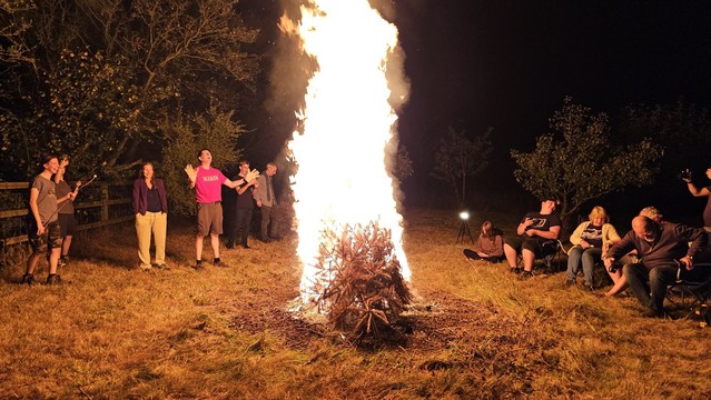 Christmas tree on a bonfire. Footleg is basking in the heat, along with Mrs. Footleg and friends and family.